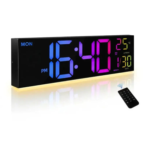 A rectangular digital wall clock with a black face and glowing LED numbers in blue, pink, and green. The clock shows the temperature and time settings.