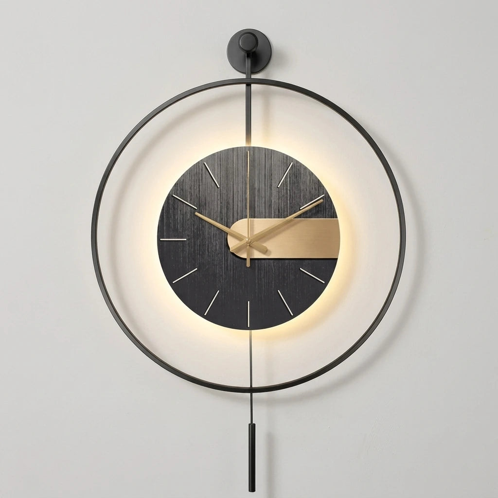 Modern wall clock with a large black circular frame, a dark wood-textured face, gold hands, and warm LED backlighting, shown hanging on a light gray wall.